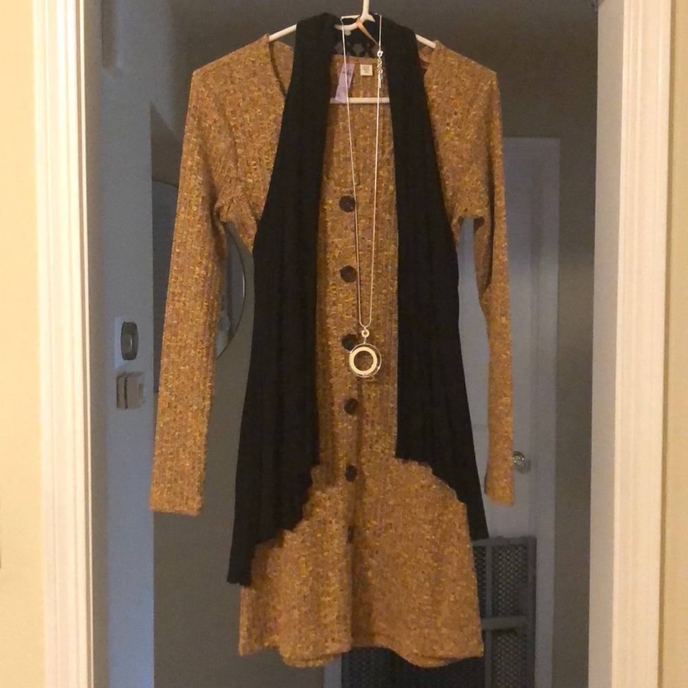 Sweater dress with black cape and and necklace